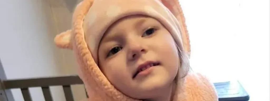 A child in a cozy bear hoodie